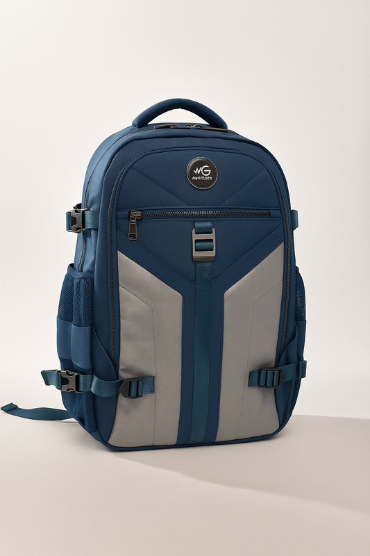 Front view of MoxieGalia Aviator IJ backpack in navy blue and gray with visible MG logo and utility compartments”