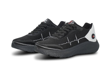 Front angle of MoxieGalia StandFX 12 sneakers in black and white featuring signature ECG side line, textured sole, and red MG logo — designed for all-day performance and bold visibility.

