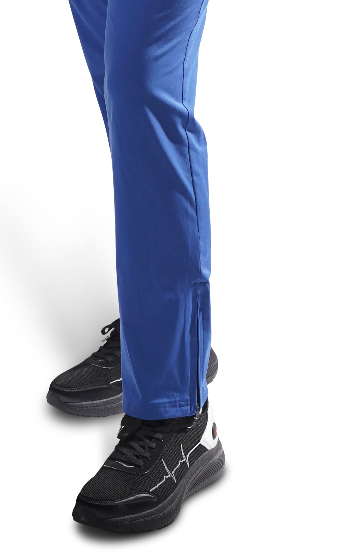 Side view of MoxieGalia StandFX 12 black sneakers with ECG line, worn with navy blue scrub pants — styled for work, long shifts, or everyday wear.